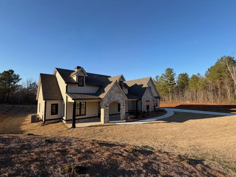 Front exterior of a new home in Harmon Springs, Carrollton, GA, highlighting curb appeal (Image 27).