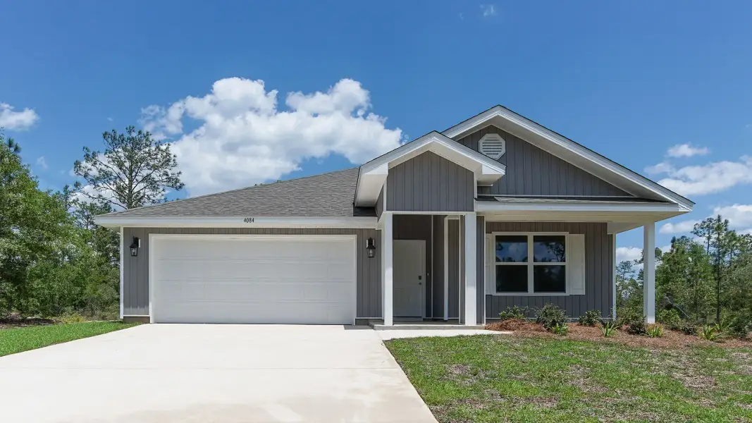 Front exterior of a new home in Magnolia at the Bluffs Phase 3, Freeport, FL, highlighting curb appeal (Image 1). Front exterior of a new home in Magnolia at the Bluffs Phase 3, Freeport, FL, highlighting curb appeal (Image 1).