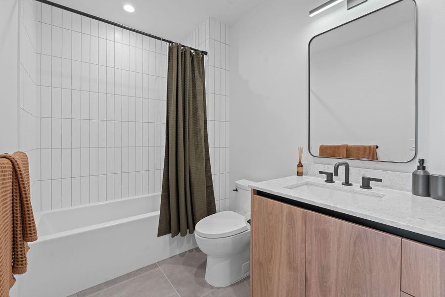 Representative Photo. Spacious secondary bathroom with full sized bath and