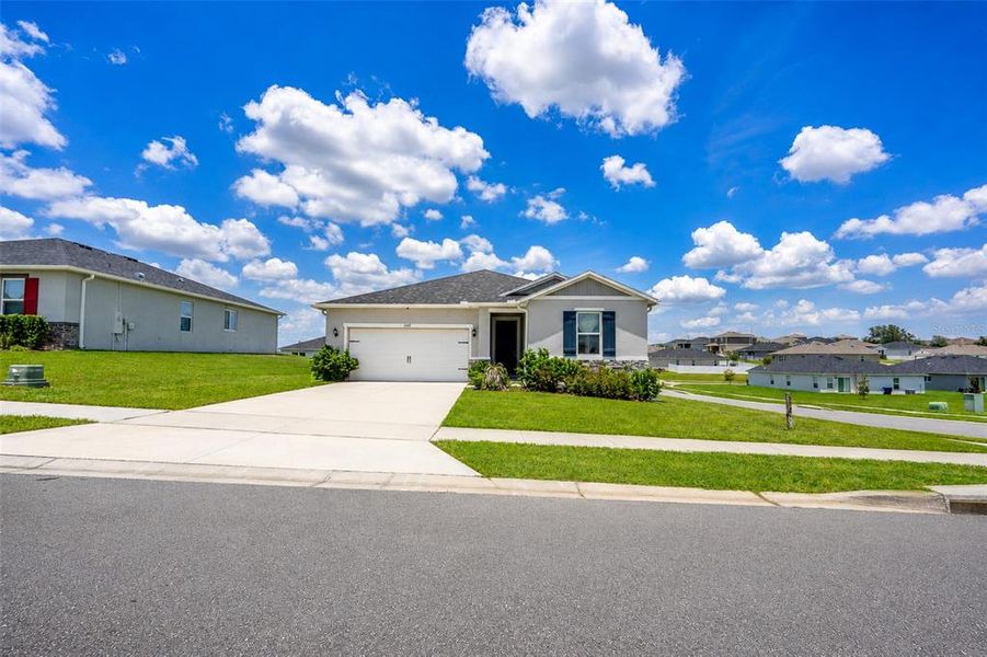 Front exterior of a new home in , Mascotte, FL, highlighting curb appeal (Image 23). Front exterior of a new home in , Mascotte, FL, highlighting curb appeal (Image 23).