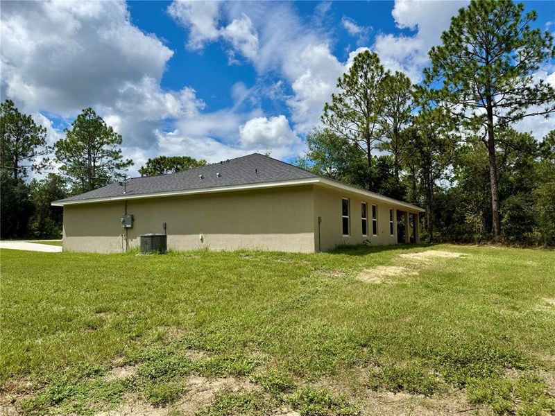 Front exterior of a new home in , Dunnellon, FL, highlighting curb appeal (Image 20).