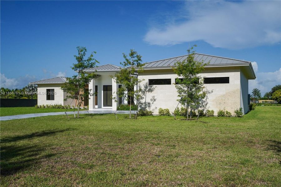 Front exterior of a new home in , Homestead, FL, highlighting curb appeal (Image 2).