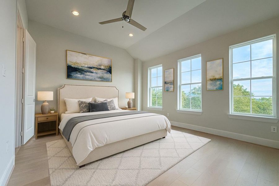 The large primary bedroom has high ceilings and large windows.   Virtual staging added.
