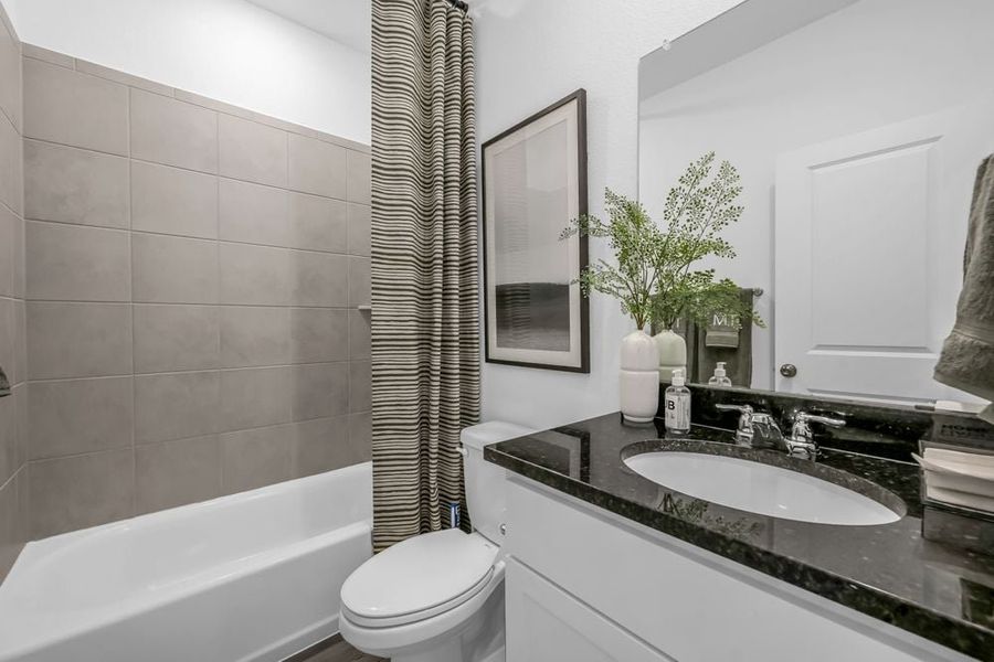 Representative furnished interior of a home built from the Robin by Taylor Morrison in Longview 50s, Del Valle (Image 26).