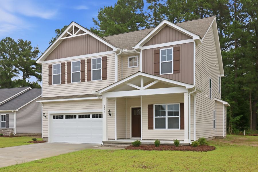 Front exterior of a new home in Davenport Farms, Winterville, NC, highlighting curb appeal (Image 23). Front exterior of a new home in Davenport Farms, Winterville, NC, highlighting curb appeal (Image 23).