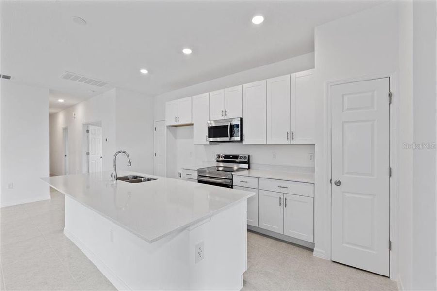 Furnished interior view inside a new home in Mirror Lake Village, Fruitland Park (Image 2).