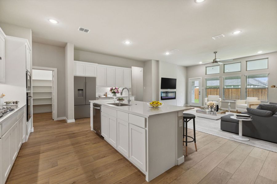 Kitchen in the Daltrey home plan by Trophy Signature Homes – REPRESENTATIVE PHOTO