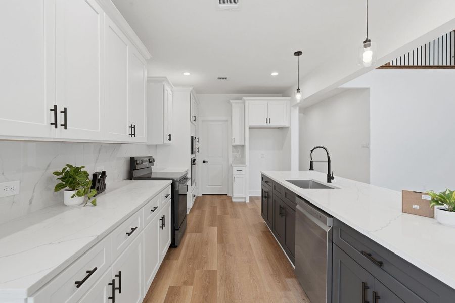 Featuring soft closed cabinets throughout