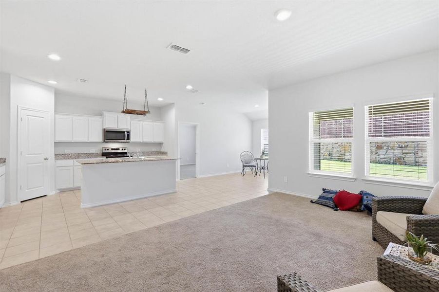 View from living to kitchen and dining areas-staged