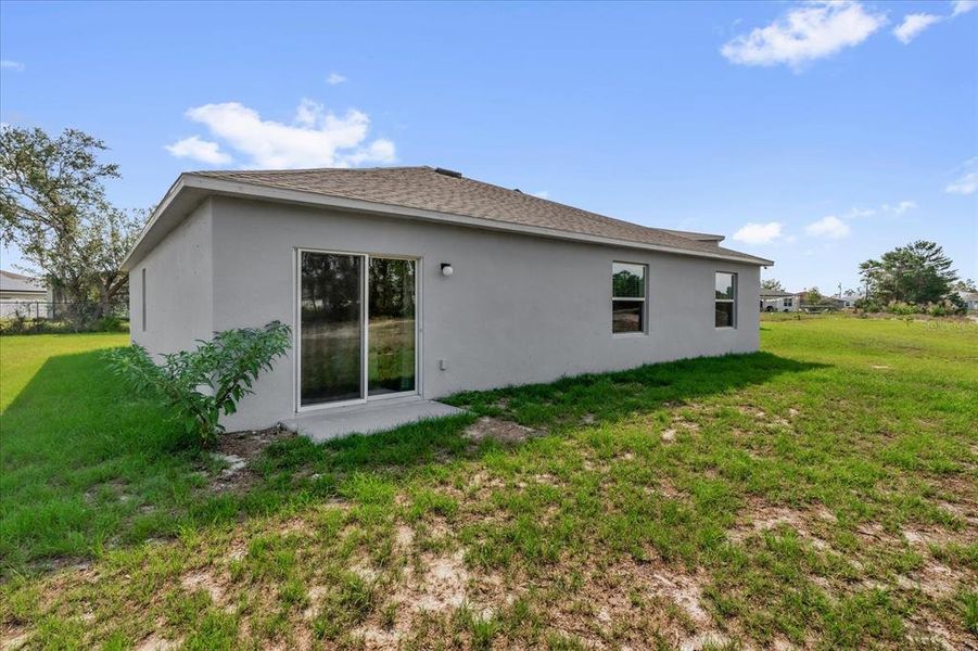 Front exterior of a new home in Poinciana, Poinciana, FL, highlighting curb appeal (Image 21).