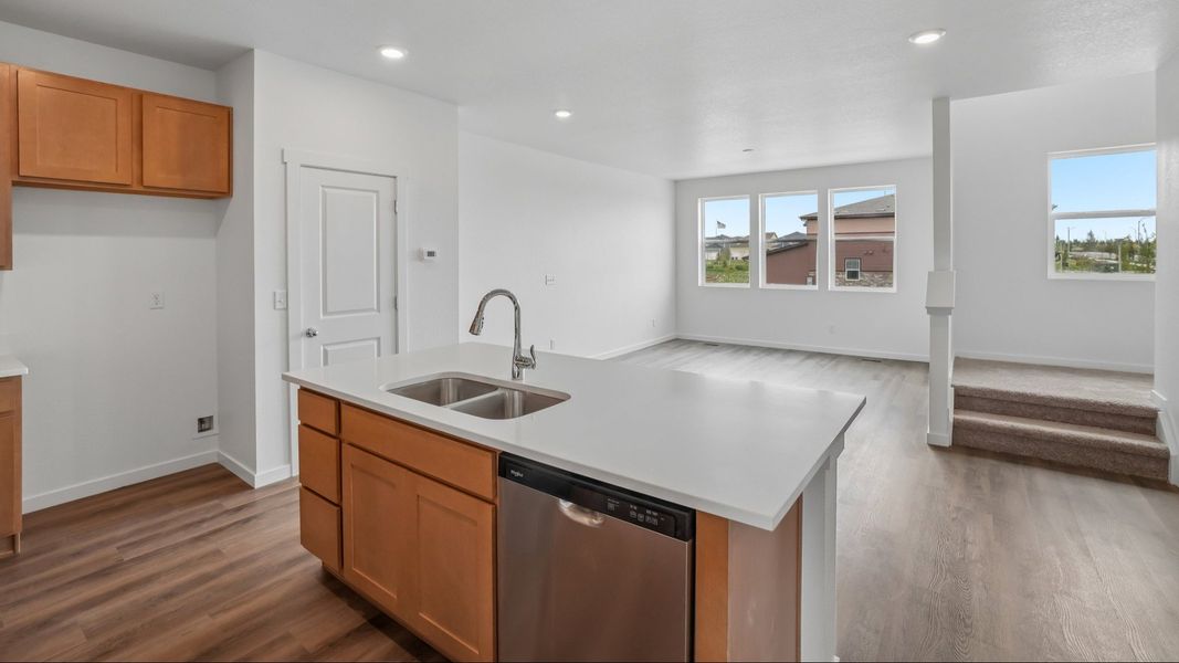 Kitchen with cabinetry, countertops, island, and modern finishes. Kitchen with cabinetry, countertops, island, and modern finishes.