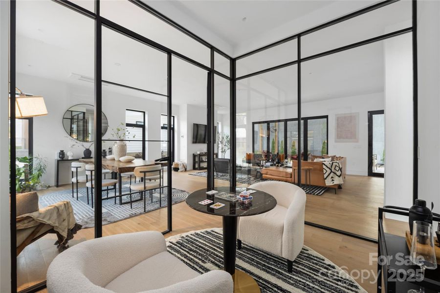 Main-level flex space, to be used as a tasting room, home office, or additional lounge area.