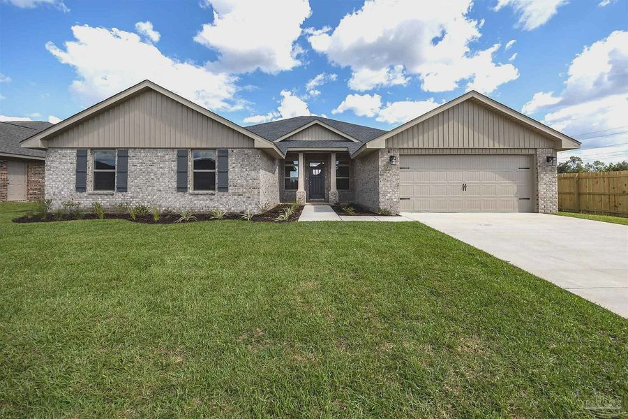 Front exterior of a new home in Emmaline Gardens, Milton, FL, highlighting curb appeal (Image 1).