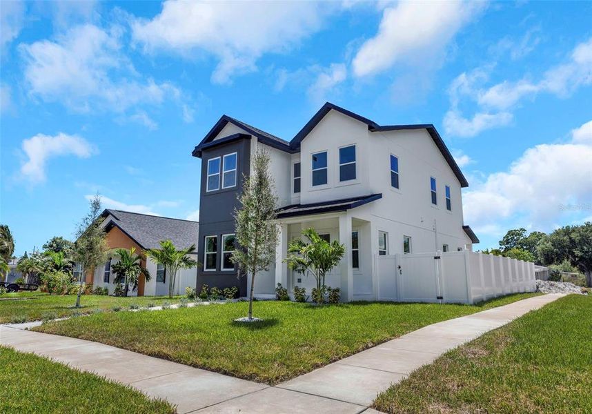 Front exterior of a new home in , St. Petersburg, FL, highlighting curb appeal (Image 1). Front exterior of a new home in , St. Petersburg, FL, highlighting curb appeal (Image 1).