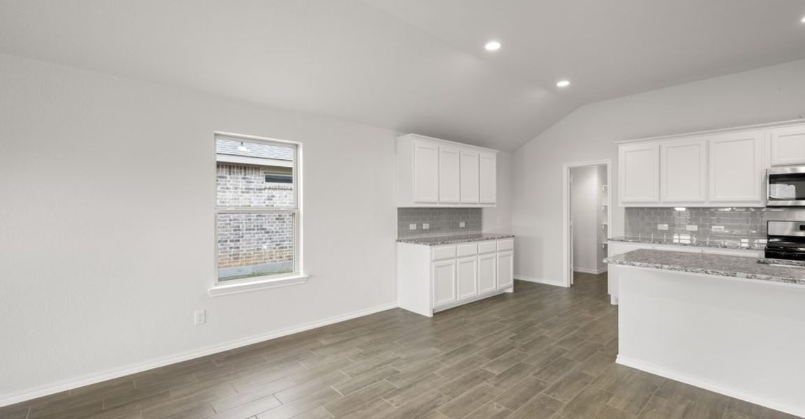 Representative exterior photo of a completed home built from the Lincoln by Impression Homes in Baker Farms, Cleburne, TX (Image 9).