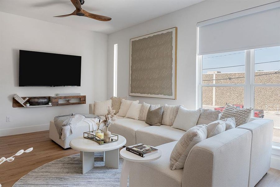 Living room with wood finished floors and ceiling fan Living room with wood finished floors and ceiling fan