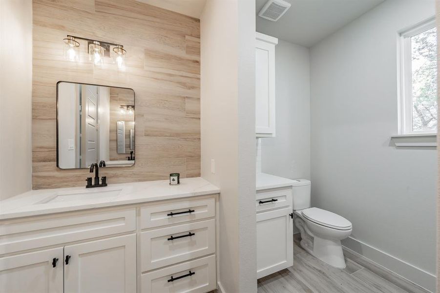 Bathroom with vanity and light wood-style floors
