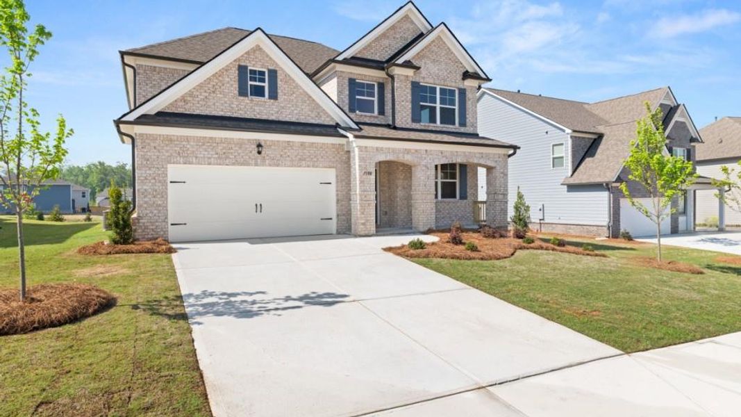 Front exterior of a new home in Butner Estates, South Fulton, GA, highlighting curb appeal (Image 2).