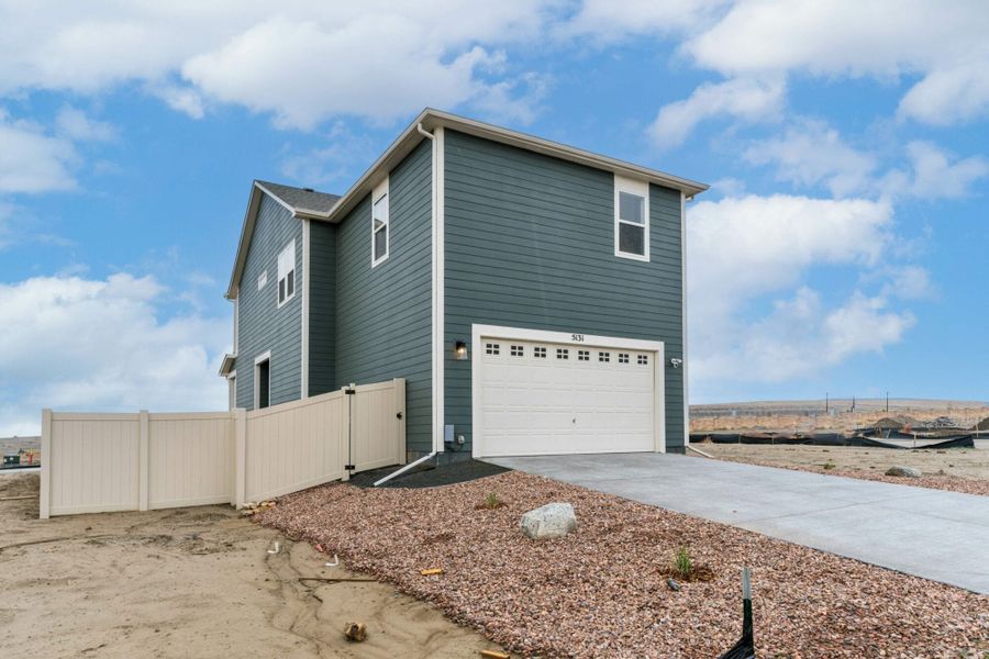 Front exterior of a new home in The Trails at Aspen Ridge – Altitude Collection, Colorado Springs, CO, highlighting curb appeal (Image 2). Front exterior of a new home in The Trails at Aspen Ridge – Altitude Collection, Colorado Springs, CO, highlighting curb appeal (Image 2).