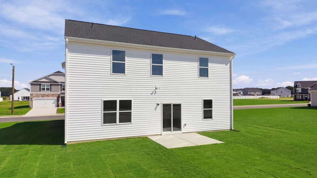 Exterior details and patio area of a home in East Ridge, Ayden (Image 4).