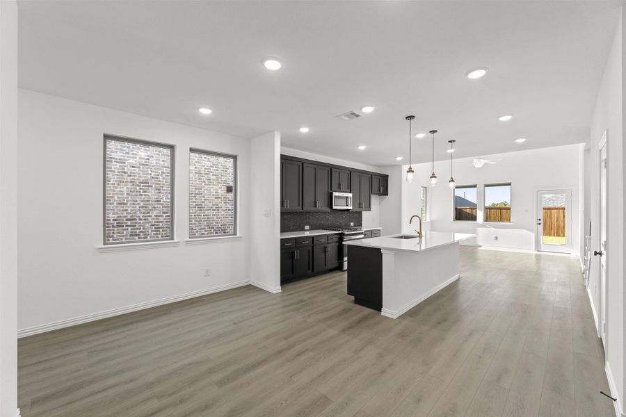 Open Kitchen-Living-Dining Room Representative Photo featuring the Noir Collection