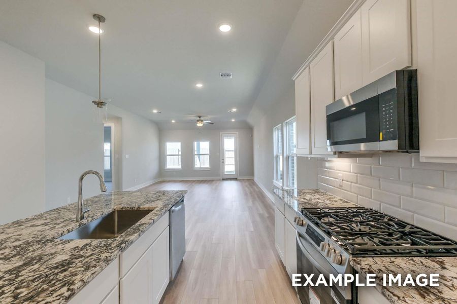 Furnished interior view inside a new home in Sunterra, Katy (Image 5).