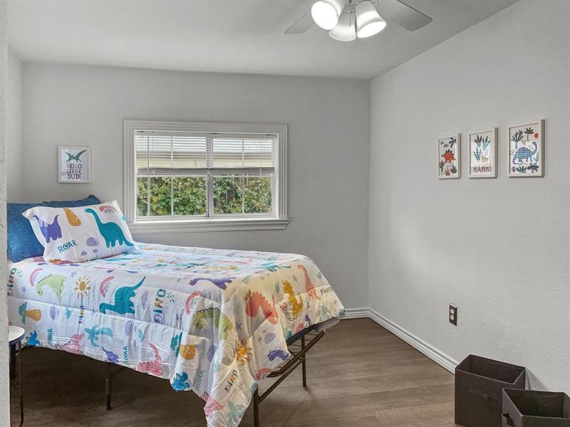 Bedroom #2 with ceiling fan and wood-type flooring