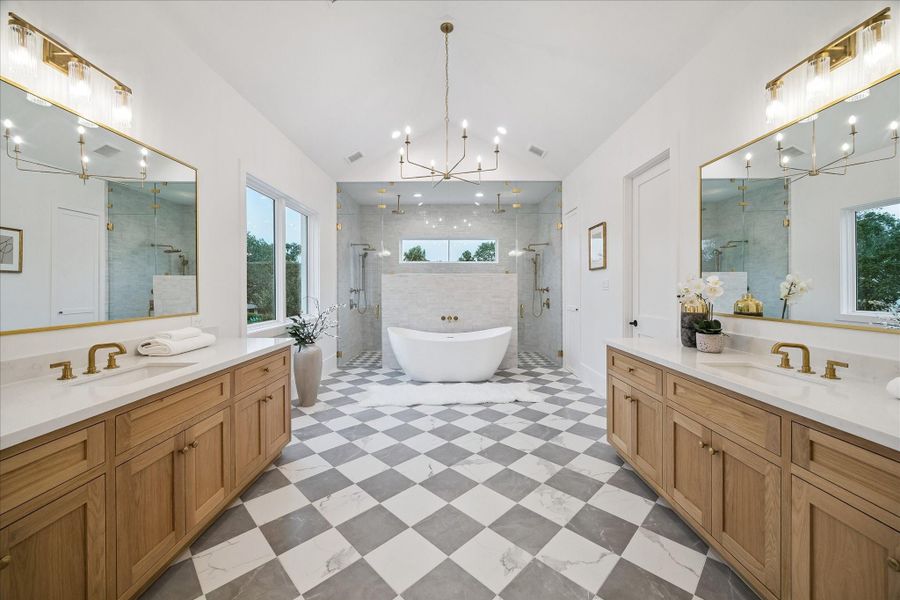 Primary bathroom has dual vanities, soaking tub, expansive double shower, and an extra room that could be a second master closet or room for a safe or storage. Primary bathroom has dual vanities, soaking tub, expansive double shower, and an extra room that could be a second master closet or room for a safe or storage.