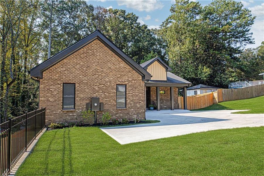 Front exterior of a new home in , Forest Park, GA, highlighting curb appeal (Image 25). Front exterior of a new home in , Forest Park, GA, highlighting curb appeal (Image 25).