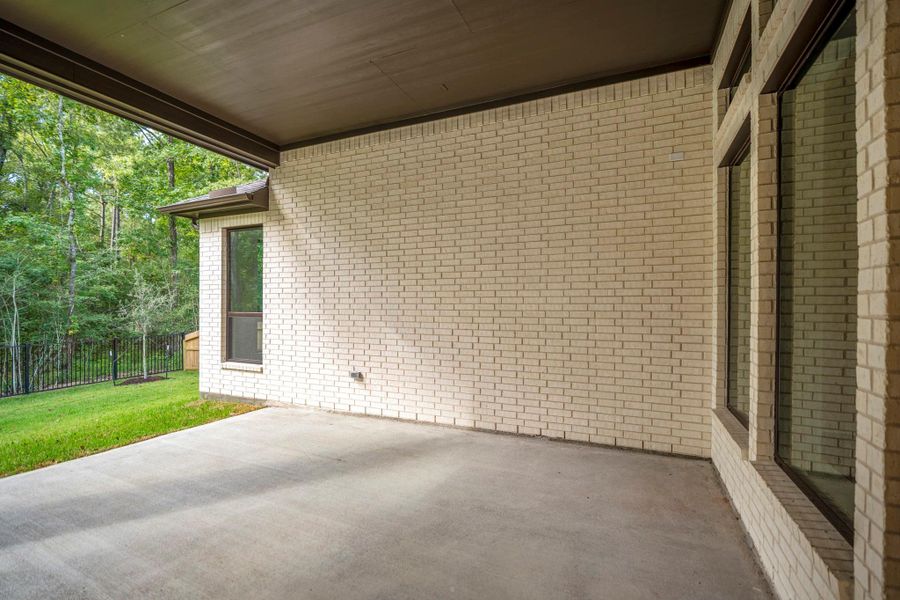 Exterior details and patio area of a home in The Woodlands Hills, Willis (Image 4). Exterior details and patio area of a home in The Woodlands Hills, Willis (Image 4).