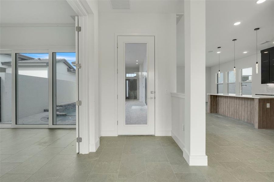 Spacious, unfurnished interior of a new home in Hampton Green at Providence, Davenport (Image 40).