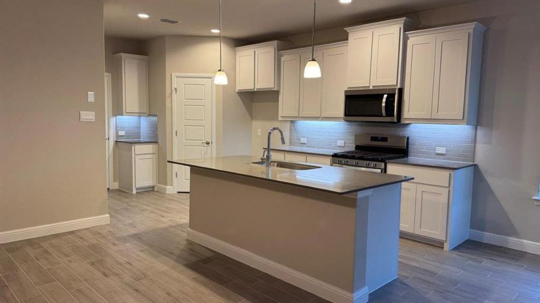 Kitchen - All Home and community information, including pricing, included features, terms, availability and amenities, are subject to change at any time without notice or obligation. All Drawings, pictures, photographs, video, square footages, floor plans, elevations, features, colors and sizes are approximate for illustration purposes only and will vary from the homes as built. Kitchen - All Home and community information, including pricing, included features, terms, availability and amenities, are subject to change at any time without notice or obligation. All Drawings, pictures, photographs, video, square footages, floor plans, elevations, features, colors and sizes are approximate for illustration purposes only and will vary from the homes as built.