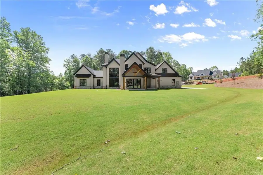 Front exterior of a new home in , Hoschton, GA, highlighting curb appeal (Image 28).