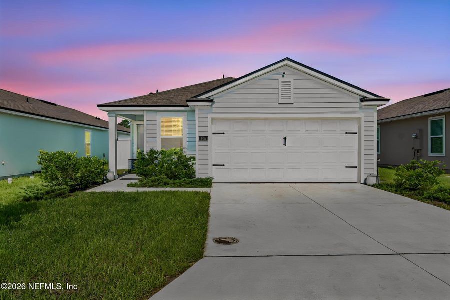 Front exterior of a new home in Ravenswood Village, St. Augustine, FL, highlighting curb appeal (Image 1). Front exterior of a new home in Ravenswood Village, St. Augustine, FL, highlighting curb appeal (Image 1).