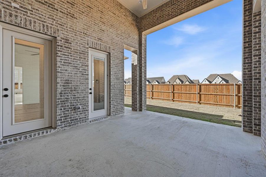 Exterior details and patio area of a home in Sandbrock Ranch: 70ft. lots, Aubrey (Image 18).