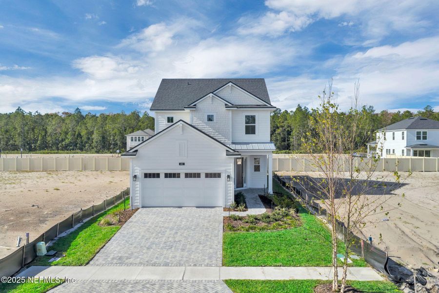 Front exterior of a new home in Seabrook Village at Seabrook, Ponte Vedra, FL, highlighting curb appeal (Image 21).