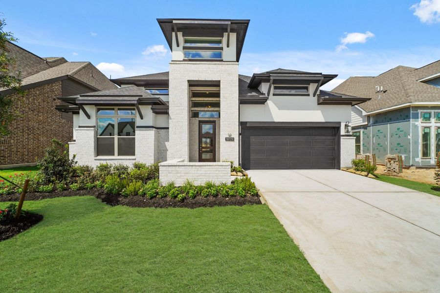 Front exterior of a new home in Bridgeland 55', Cypress, TX, highlighting curb appeal (Image 2).