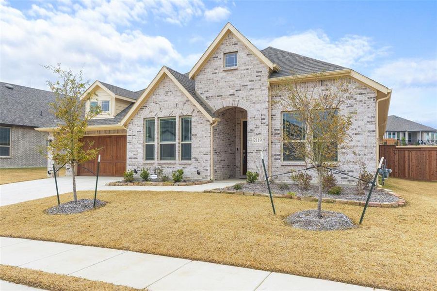 Front exterior of a new home in , Forney, TX, highlighting curb appeal (Image 1). Front exterior of a new home in , Forney, TX, highlighting curb appeal (Image 1).