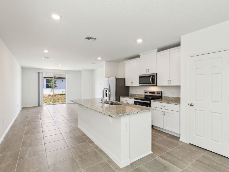 Furnished interior view inside a new home in Villamar - Classic Series, Winter Haven (Image 4). Furnished interior view inside a new home in Villamar - Classic Series, Winter Haven (Image 4).