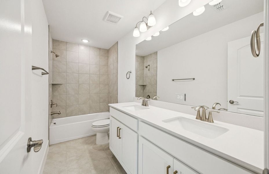 Stylish secondary bath with high-end fixtures  *Real home pictured