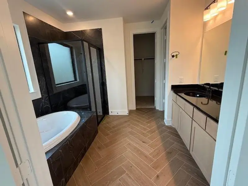 Furnished interior view inside a new home in WILDTREE 50', Montgomery (Image 11).