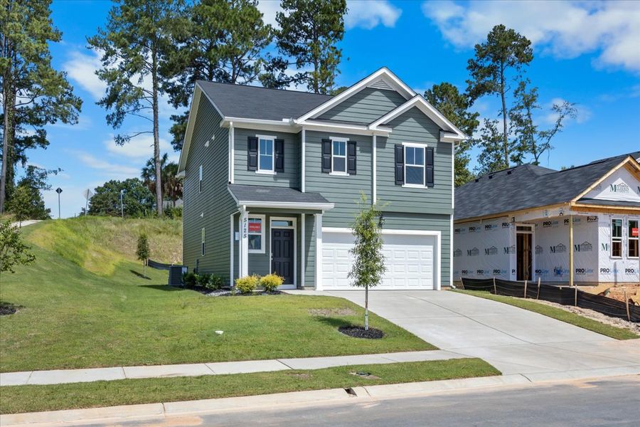 Front exterior of a new home in Forrest Bluff, North Augusta, SC, highlighting curb appeal (Image 16). Front exterior of a new home in Forrest Bluff, North Augusta, SC, highlighting curb appeal (Image 16).
