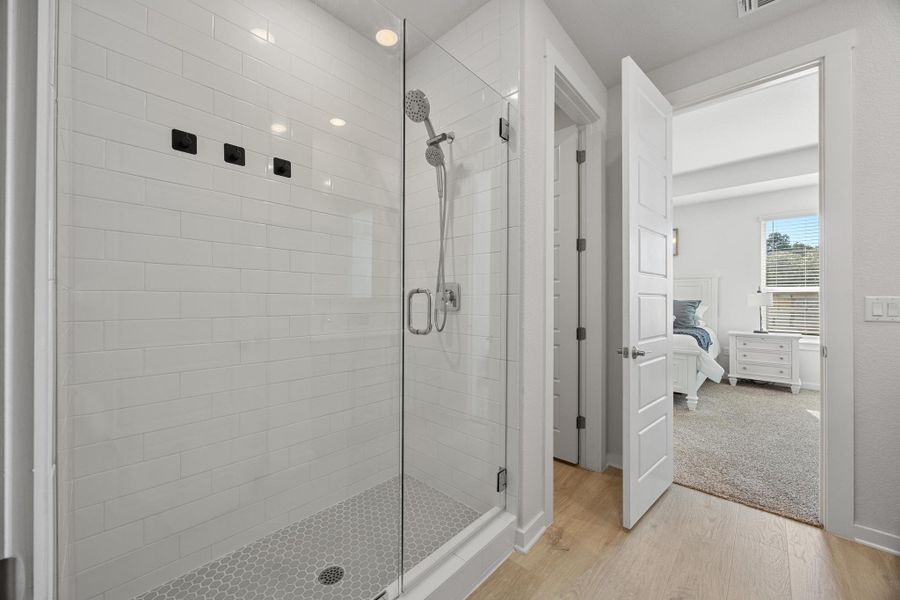 Ensuite bathroom featuring ensuite bath and a walk in shower.