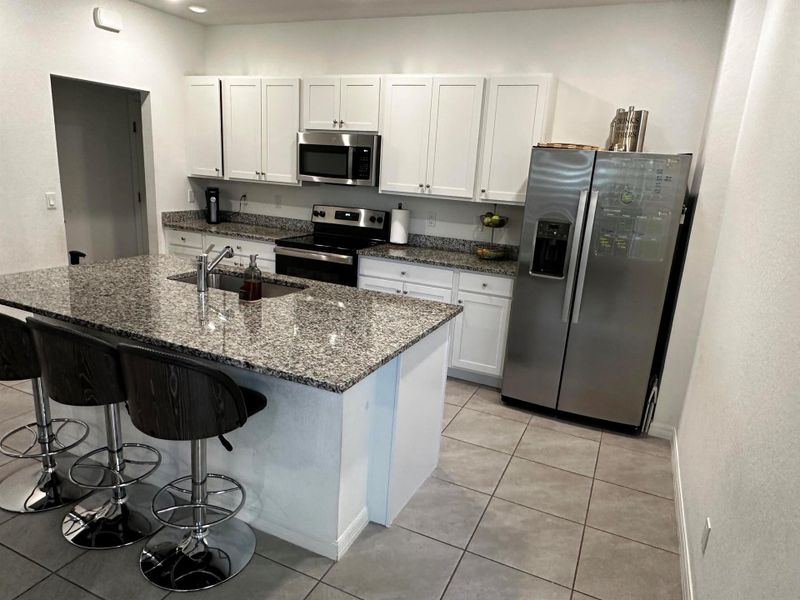 Furnished interior view inside a new home in Aspire at East Lake, Port St. Lucie (Image 8). Furnished interior view inside a new home in Aspire at East Lake, Port St. Lucie (Image 8).
