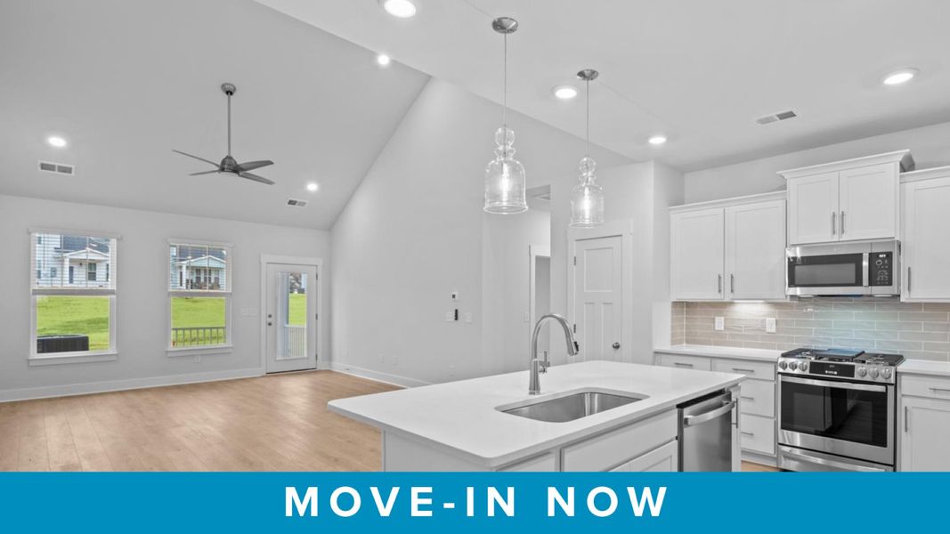 Accomplished kitchen design featuring pendant lighting above a statement island for both prep and gathering Accomplished kitchen design featuring pendant lighting above a statement island for both prep and gathering