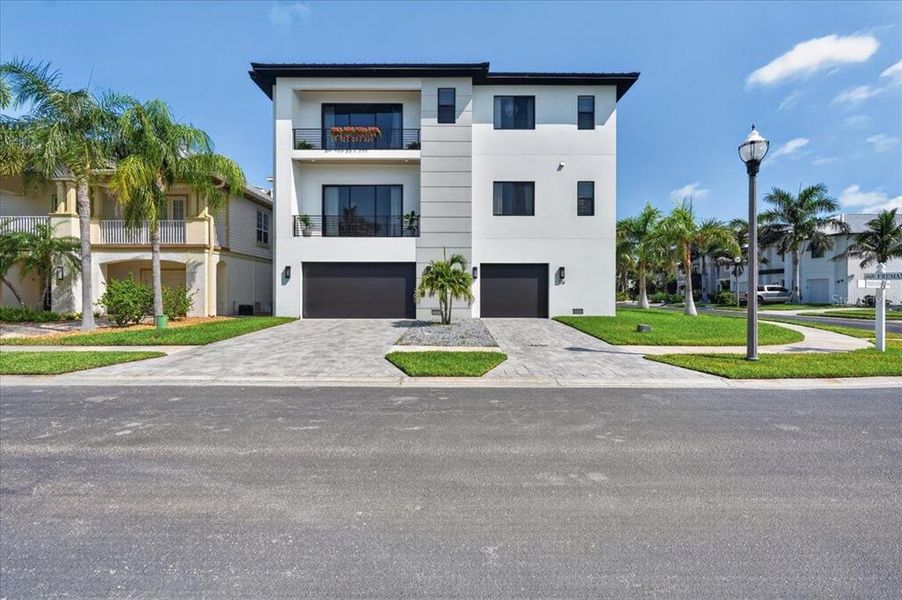 Front exterior of a new home in , Redington Shores, FL, highlighting curb appeal (Image 28).