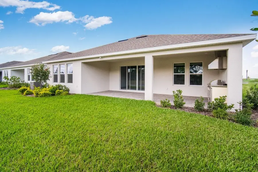 Exterior details and patio area of a home in Harvest at Ovation, Winter Garden (Image 2). Exterior details and patio area of a home in Harvest at Ovation, Winter Garden (Image 2).