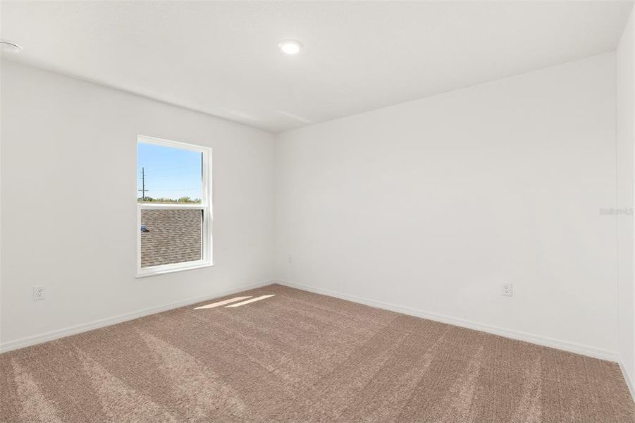 Spacious, unfurnished interior of a new home in Peach Crossings, Winter Haven (Image 21).