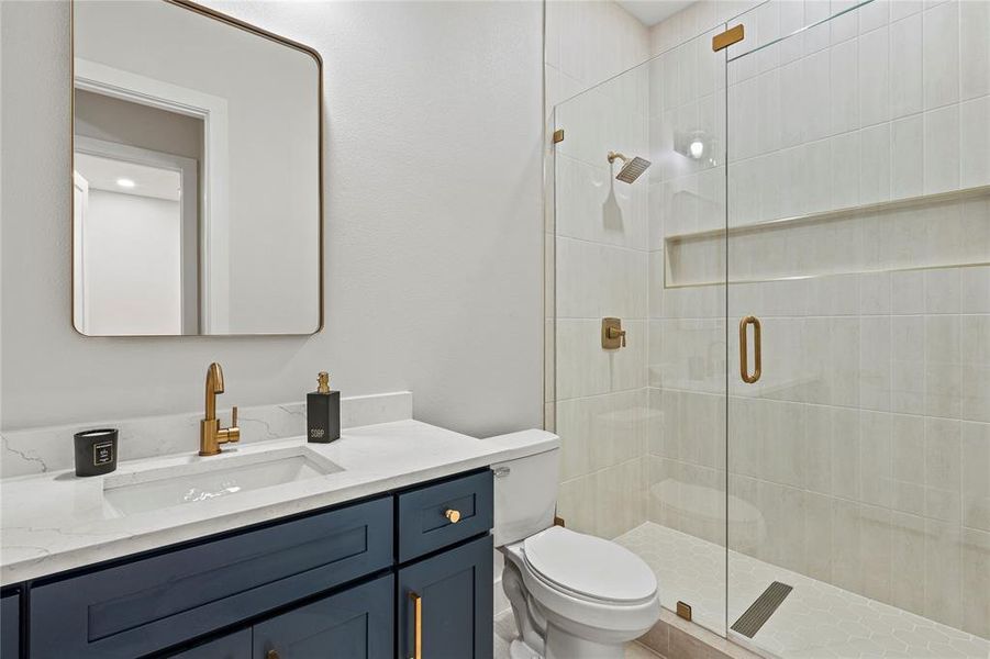 Full bath with vanity and a shower stall Full bath with vanity and a shower stall