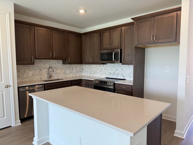 Kitchen featuring AW Collection® Roosevelt and a large island - under construction